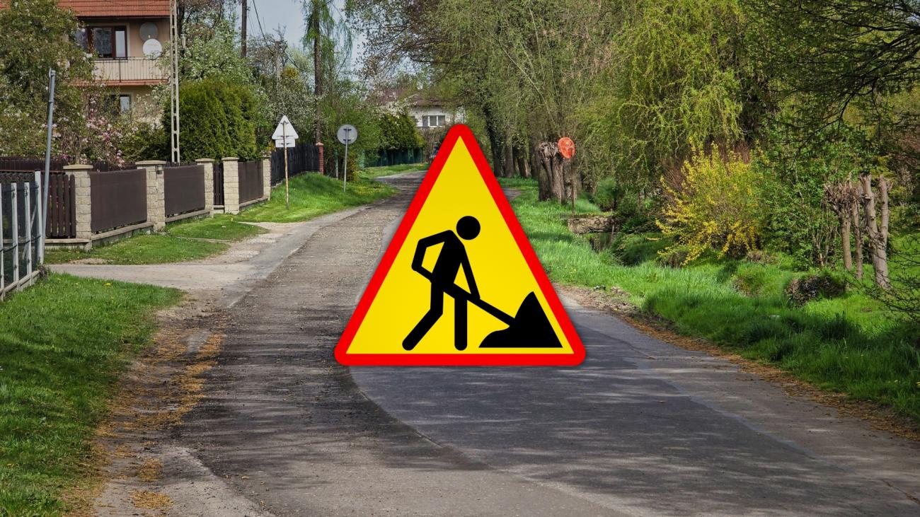 znak roboty drogowe na tle zdjęcia ulicy Rolników w Ligocie